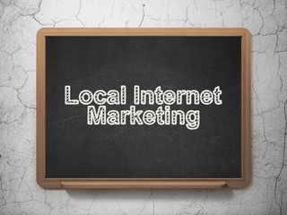 Advertising concept: Local Internet Marketing on chalkboard background