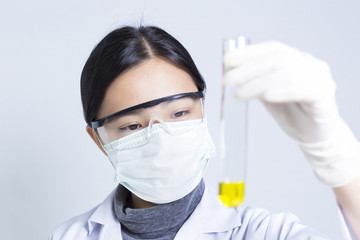 Woman Sciencetist: Researcher Holding at a Liquid Solution on Is