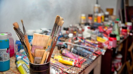 artist's Studio. Bunch of paintbrushes closeup, selective focus.