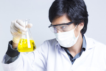 Sciencetist: Researcher Holding at a Liquid Solution on Isolated