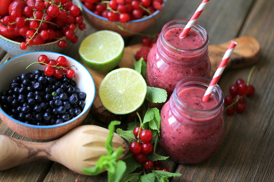 Smoothie with strawberries, blueberries in jars