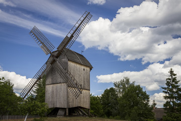 Fototapeta na wymiar An old wooden windmill