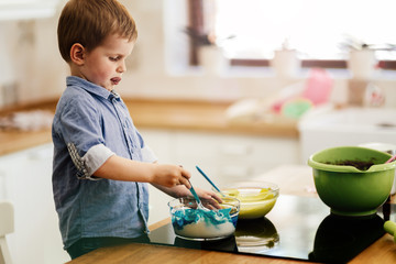 Cute child learning to become a chef