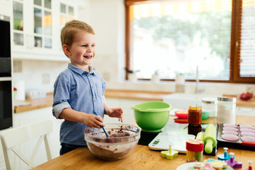 Cute child learning to become a chef