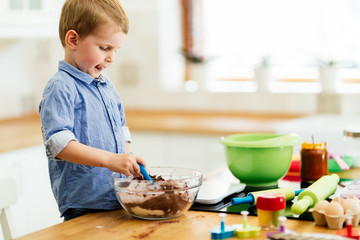 Cute child learning to become a chef