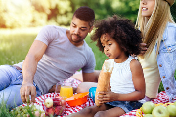 Beautiful afro kid holding baguette