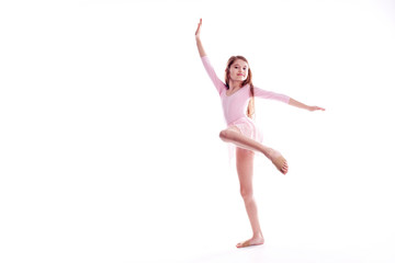 Young excited girl jumping in the studio