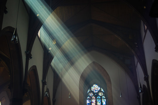 Light Shafts Stream Into Church Window