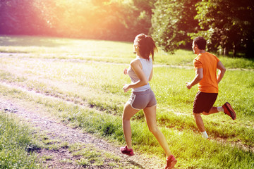 Beautiful couple jogging in nature