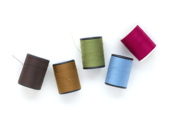 brautiful colors of thread on white background