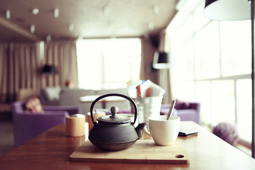 teapot and cup of tea at a cafe