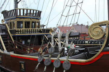 Pirate ship in the port.  - obrazy, fototapety, plakaty