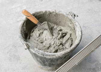 Pick up a trowel and cement mix concrete is compacted sand
