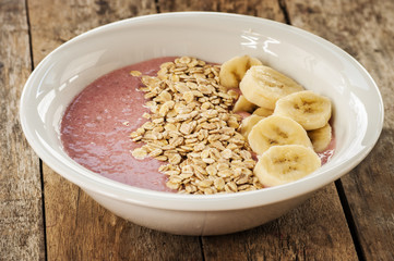 Healthy muesli breakfast with yoghurt, muesli, strawberries and banana