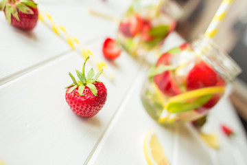 Refreshing summer drink with Strawberry on the vintage wooden table