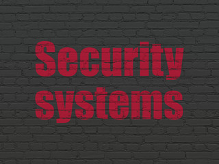 Protection concept: Security Systems on wall background