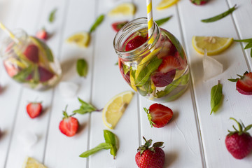 Pink lemonade with lemon and strawberries
