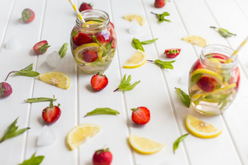 Fresh cold lemonade with ice cubes and mint.
