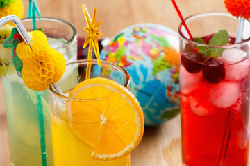 Refreshing cocktails and Globe, concept