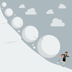 Fototapeta premium Business woman running away from snowball effect