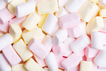 Mixed white, pink and yellow marshmallows as background