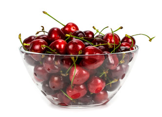 Fototapeta na wymiar Fresh cherry fruits in a glass bowl isolated on a white backgro