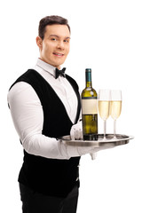 Waiter holding wine and two glasses