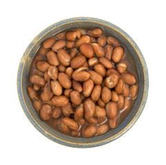 Bowl of shelled beans on a white background top view.