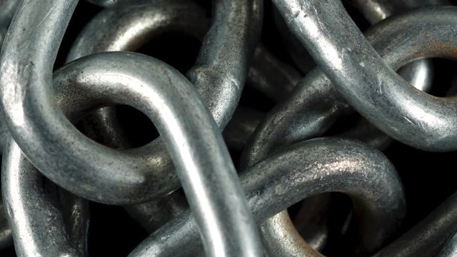 Gently Zooming In on a Pile of Chain Showing Increasing Detail.