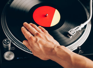 turntable scratch, hand of dj on the vinyl record