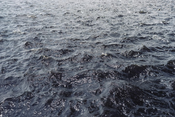 The ripples from strong wind on the river