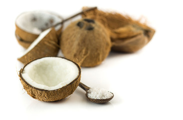 Half of coconut and grated on white background