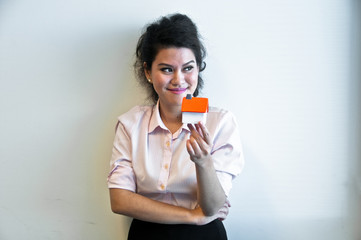 Business woman hold house toy model on white background