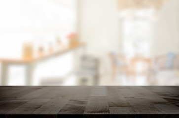 Selected focus empty brown wooden table and space of Coffee shop