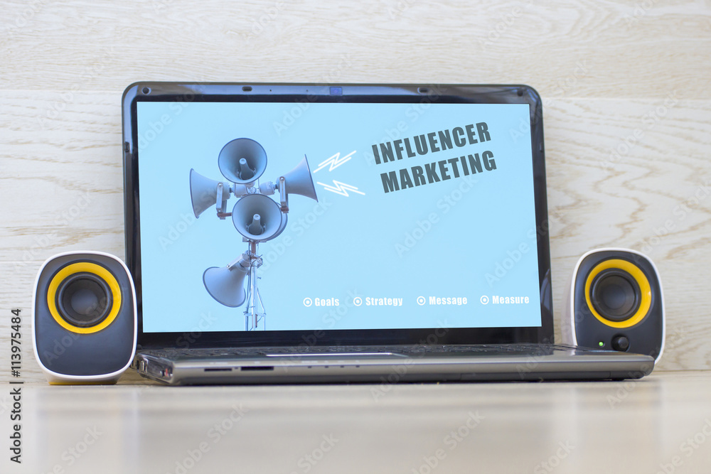 Fototapete influencer concept. close-up view of laptop with a blank screen and external speakers to the sides. 