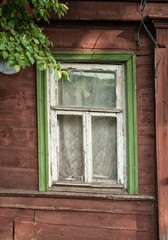 Old wooden window on the ancient house