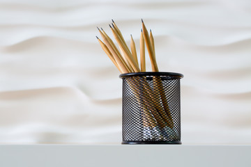 Lead pencils in metal pot