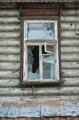 Old wooden window on the abandoned house