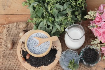 Obraz na płótnie Canvas Basil seeds for fiber beverage with milk.