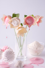 Beautiful and delicate bouquet of flowers with ice cream, which is derived from flowers and drops falling on the table.