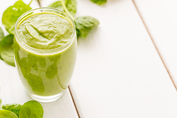 Absolutely Amazing Tasty Green Avocado Shake, Made with Fresh Avocados, Banana, Lemon Juice and Non Dairy Milk (Almond, Coconut) on Light White Wooden Background, Raw, Vegan Drink Conception, Close-up