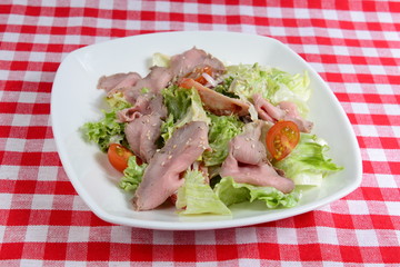 Italian food: fresh salad with Vitello Tonnato