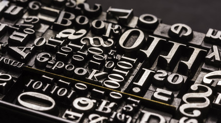 Metal Letterpress Types.
A background from many historic typographical letters in black and white with white background. - obrazy, fototapety, plakaty