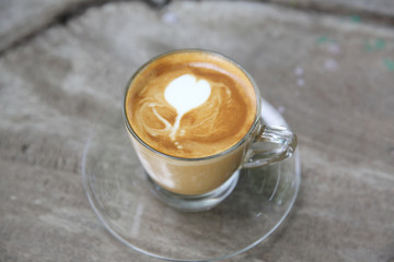 cappuccino coffee on wood background