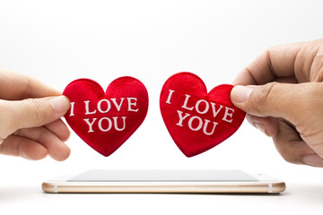  woman and man holding red heart 