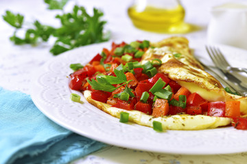 Omelette stuffed with bell pepper and carrot.