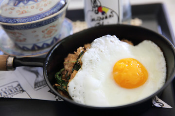 Stir fried pork and basil served with rice and fried egg