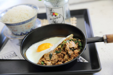 Stir fried pork and basil served with rice and fried egg