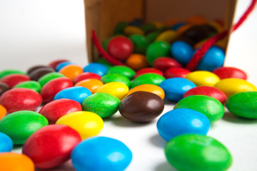 A paper bag with colorful candies