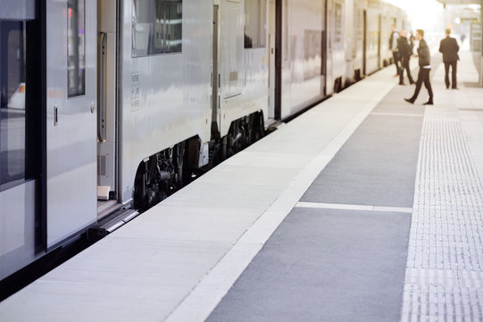 Fototapeta Passengers and commuter train